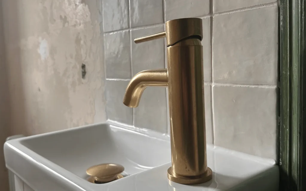 Brushed brass cloakroom basin and tap installed by Plumb Inc in Taunton, Somerset